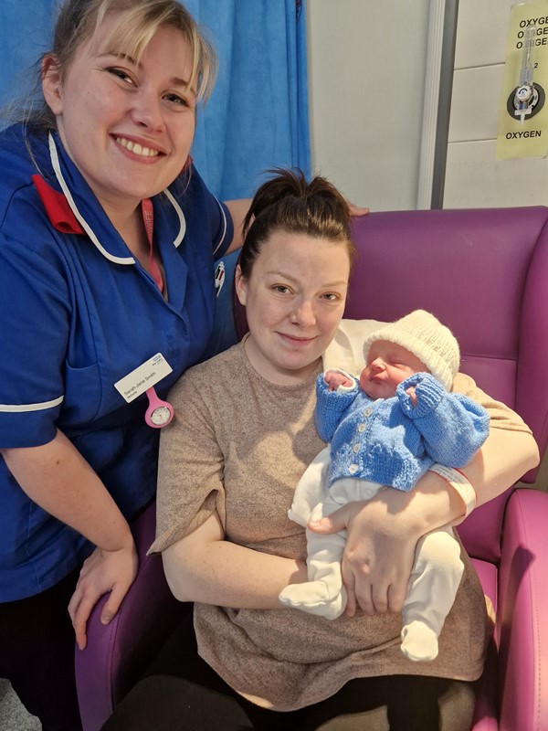 First baby of the year, Finley, with his mum Charlie Evans, dad Aled Weale with midwife Sarah-Jane Smith